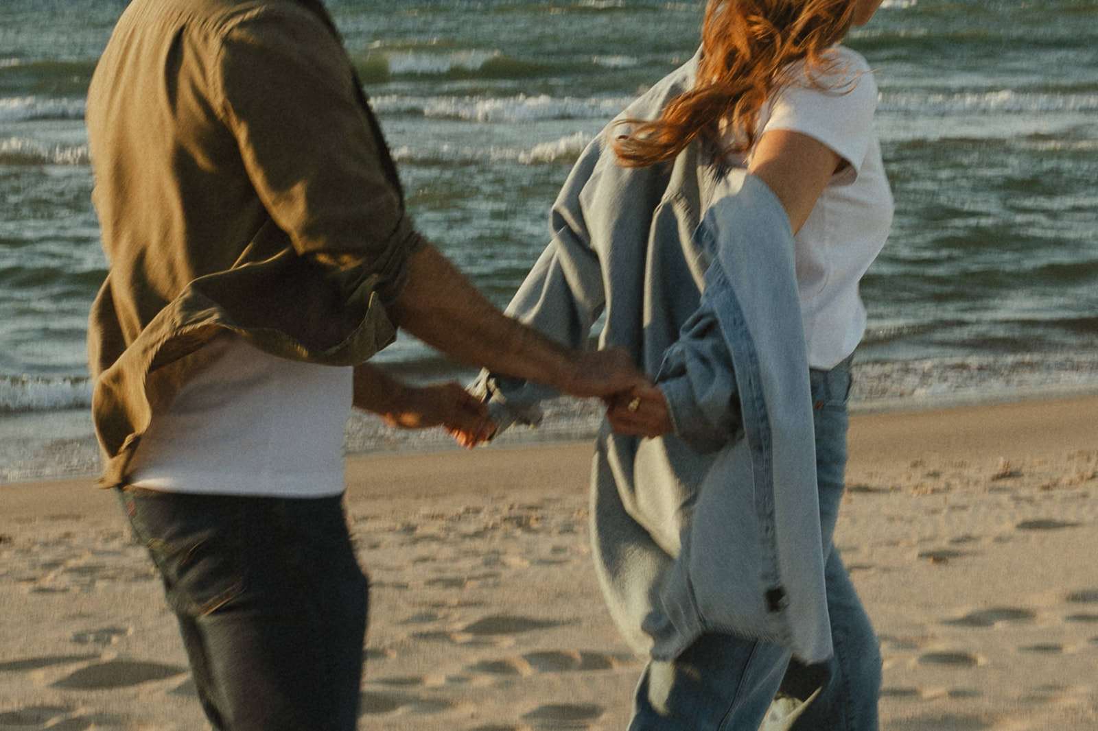 A beach engagement photo at Lake Michigan